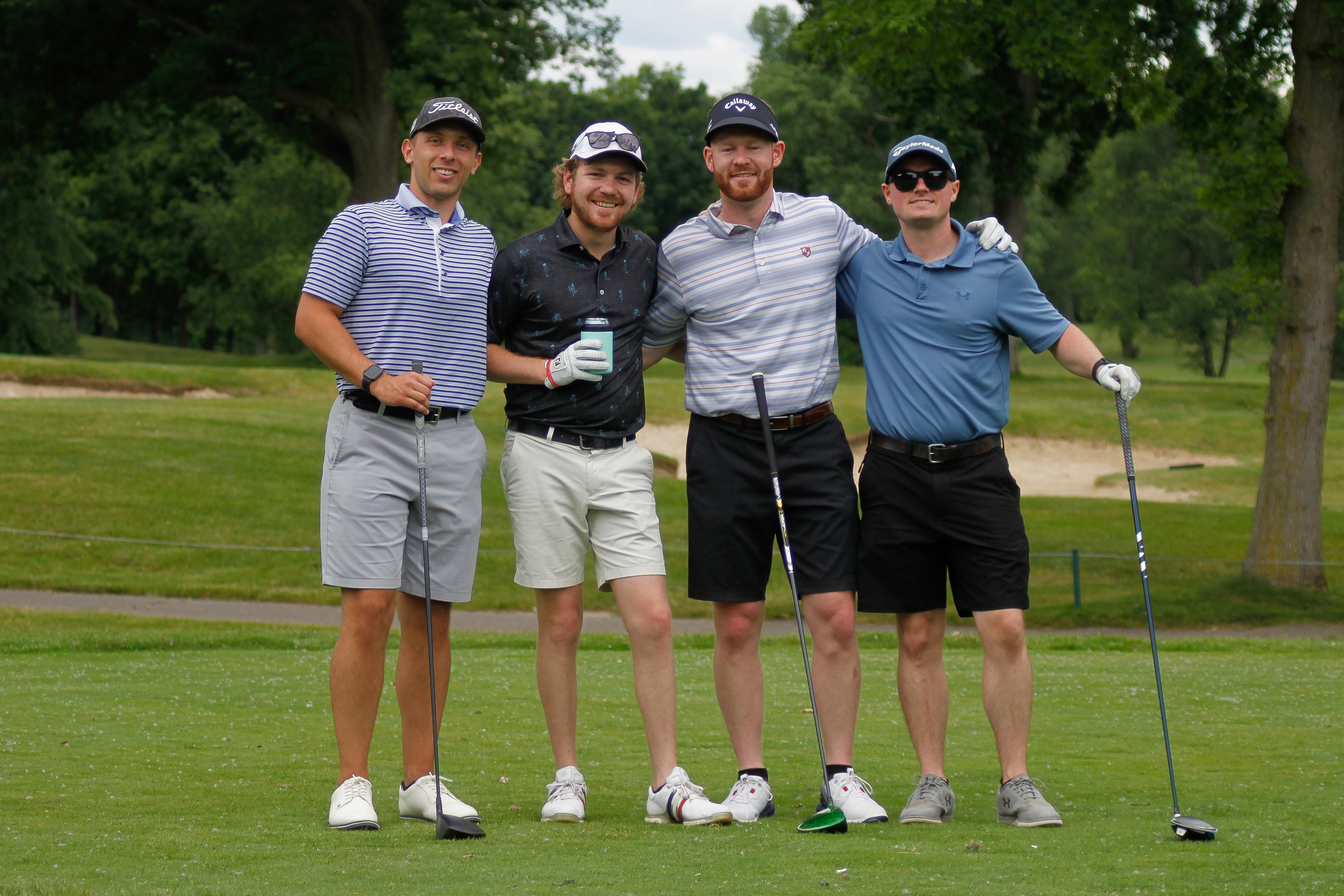 Alumni posing at the golf outing