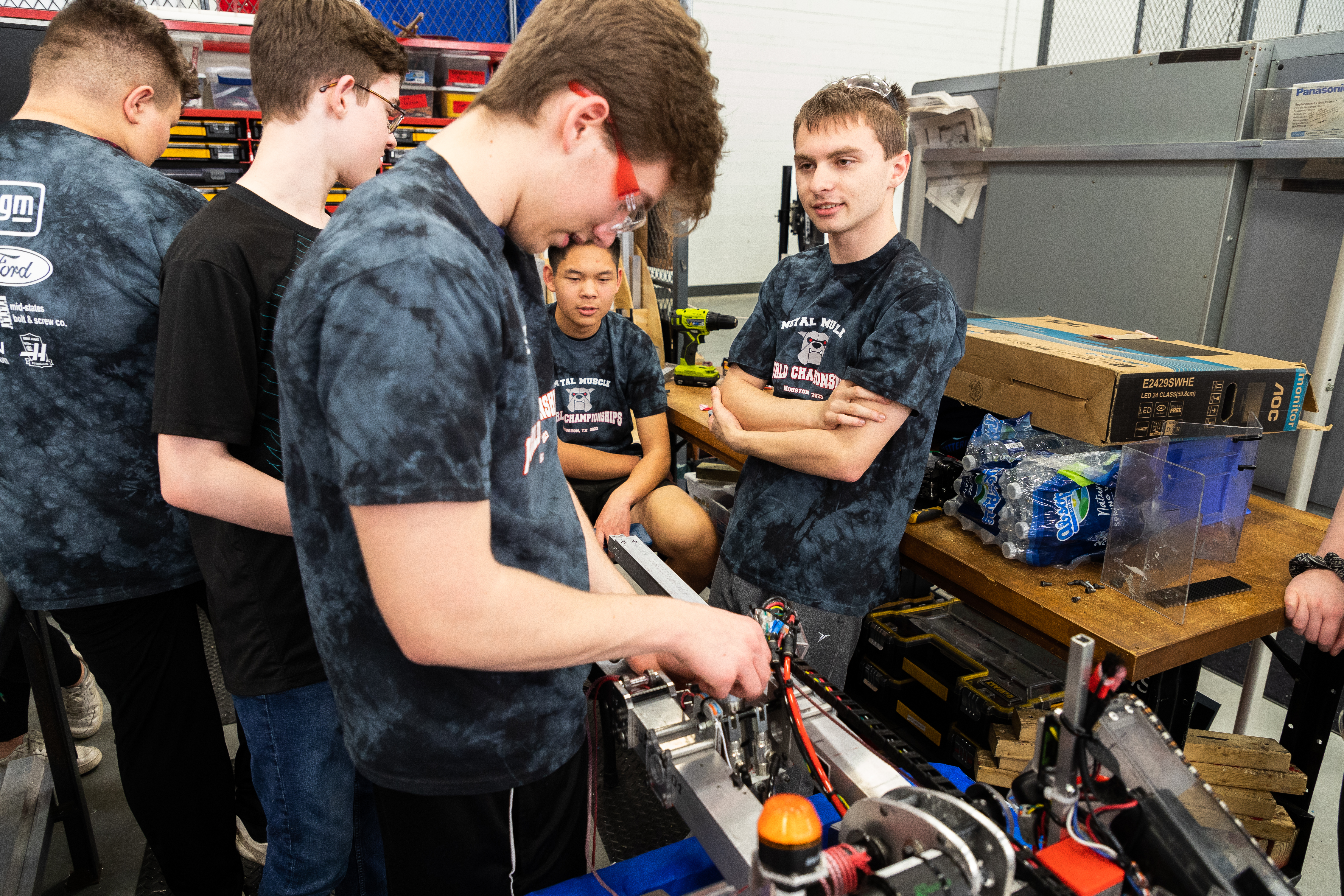 Metal Muscle team members work on their robot at Kettering University's Robotics Community Center.