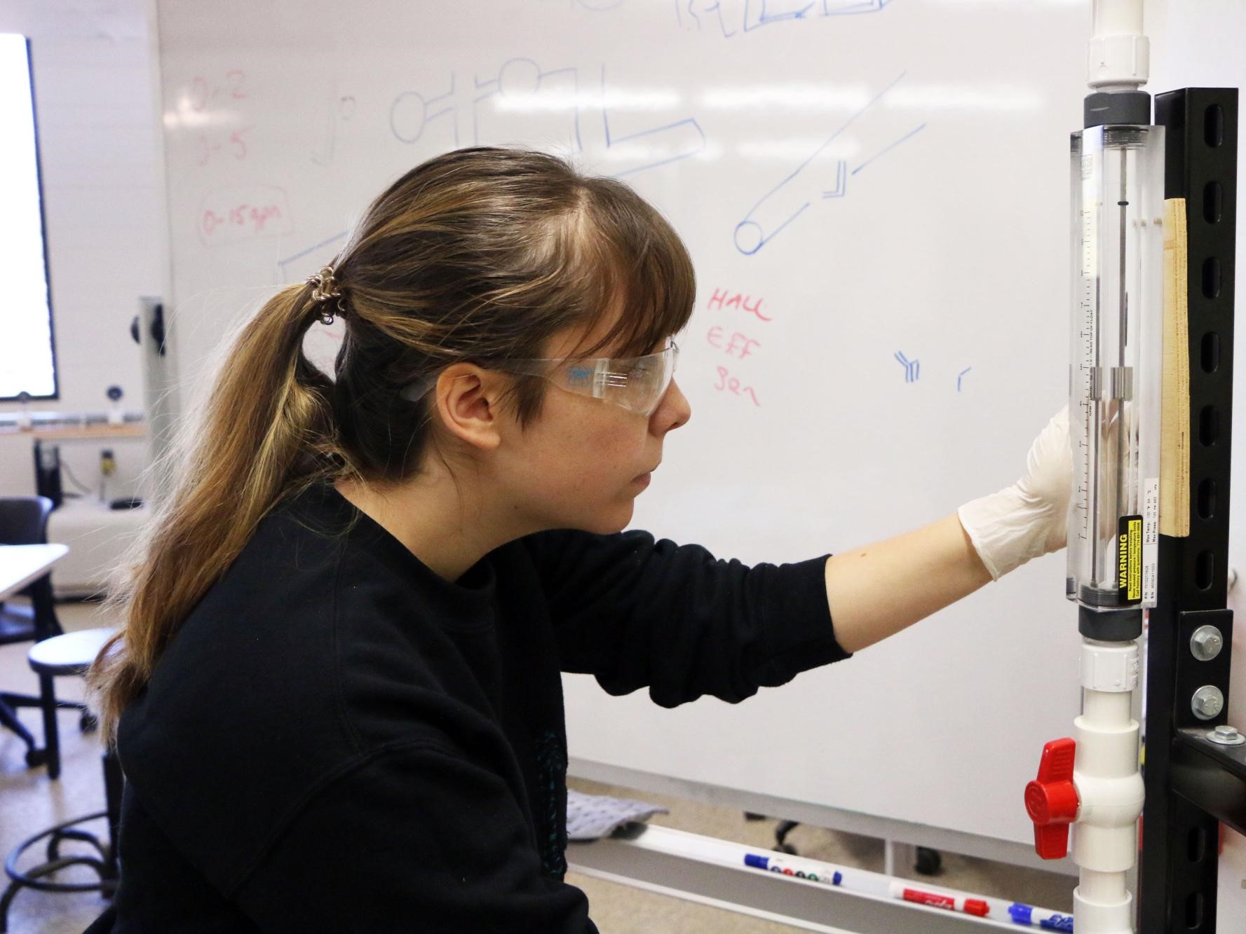 Chemical engineering student checks lab results