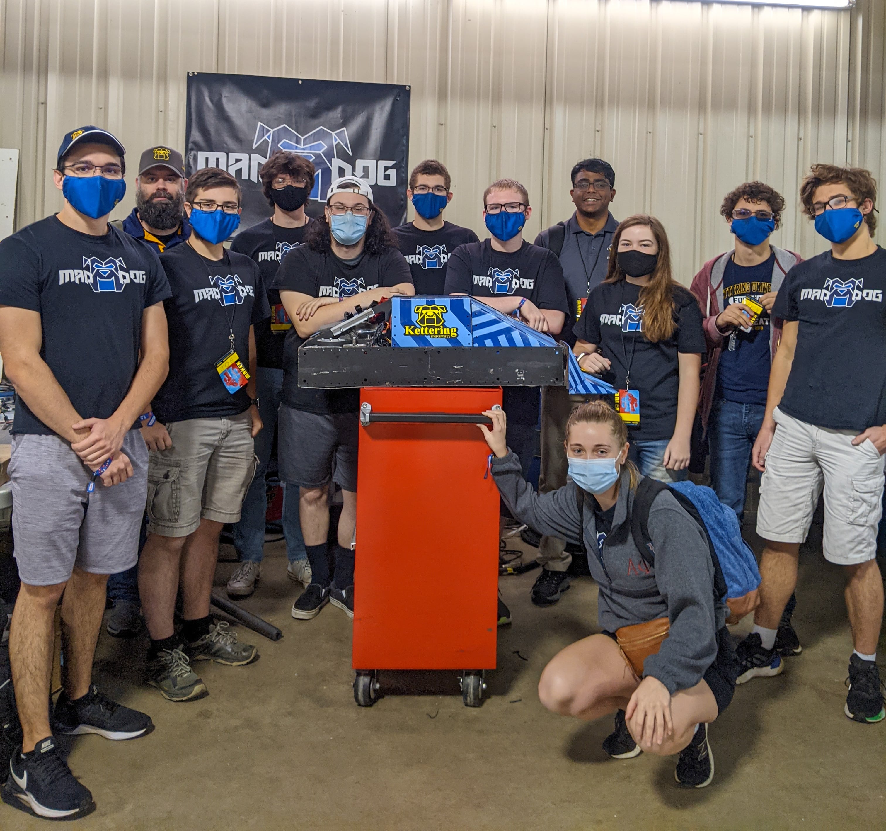 Kettering University's combat robotics team pose with its robot, Mad Dog.