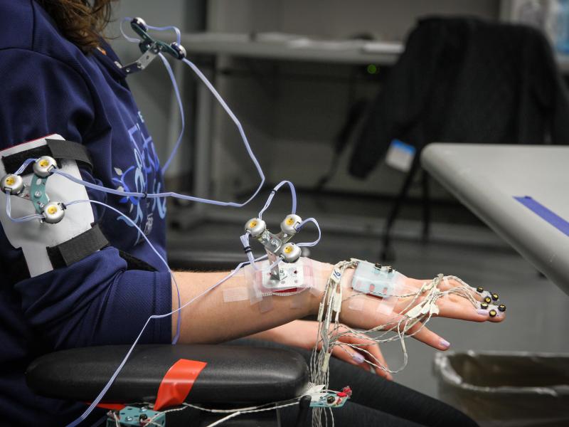 A participant undergoes advanced biomechanical testing in Kettering University's Human Interfaces Ergonomics Laboratory, utilizing sensors to analyze motion and muscle activity.