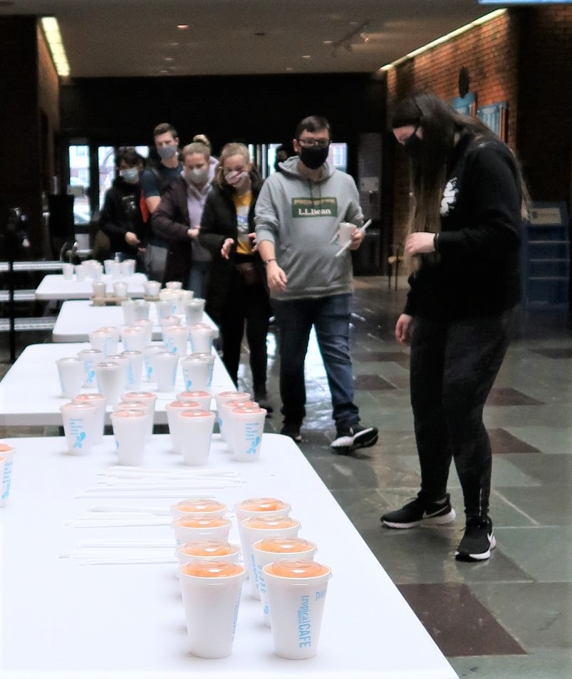 Students line up to pick up free smoothies.