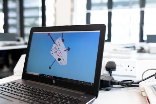 A 3D design displayed on laptop.
