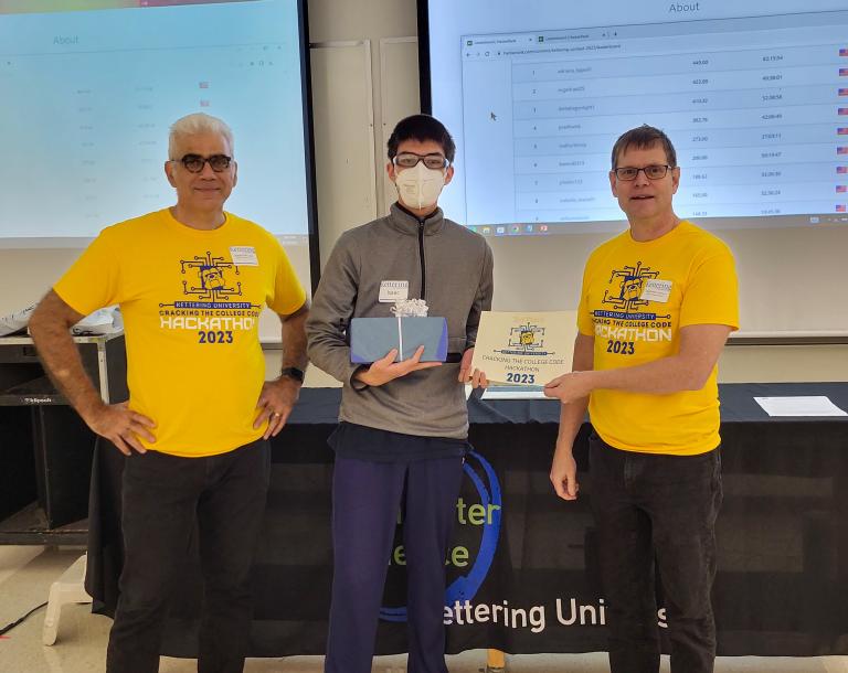 From left, Dr. Babak Elahi, Dean of the College of Sciences and Liberal Arts, Isaac Kellog, third-place winner and Dr. Michael Farmer, Head of the Department of Computer Science at Kettering University.