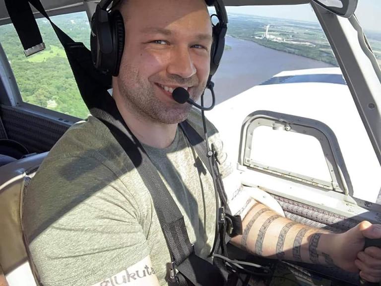 Kettering University alumni Josh Sweers flying an aircraft.