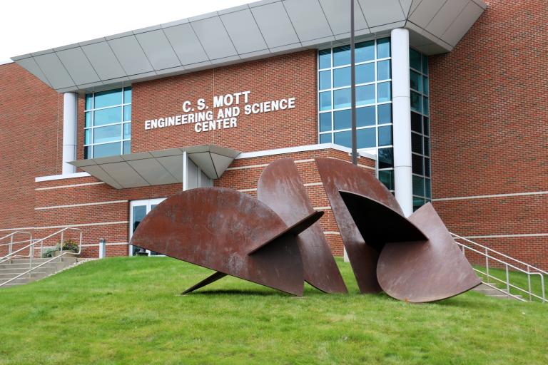 A sculpture in front of the Mott Center academic building.