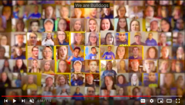 A screenshot of a video featuring a collage of faces.