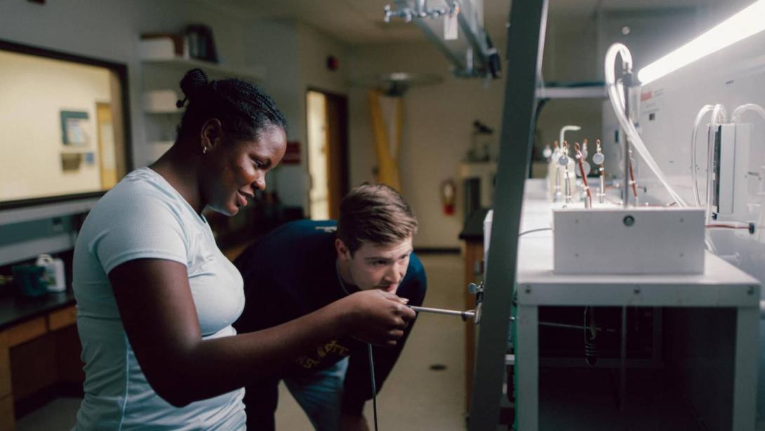 Two students working together in lab