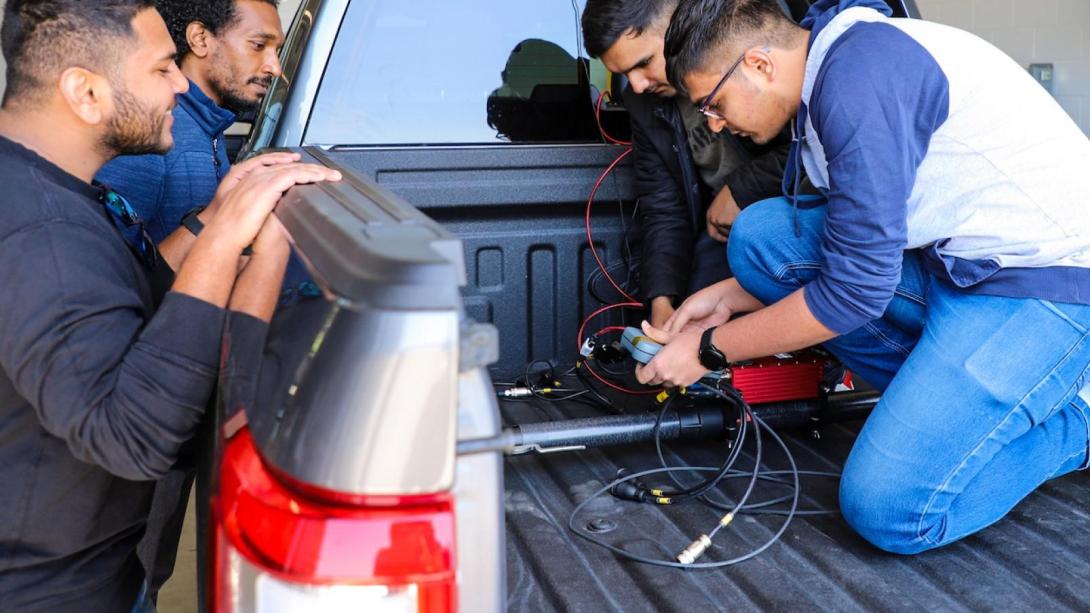 Graduate students brake testing vehicle