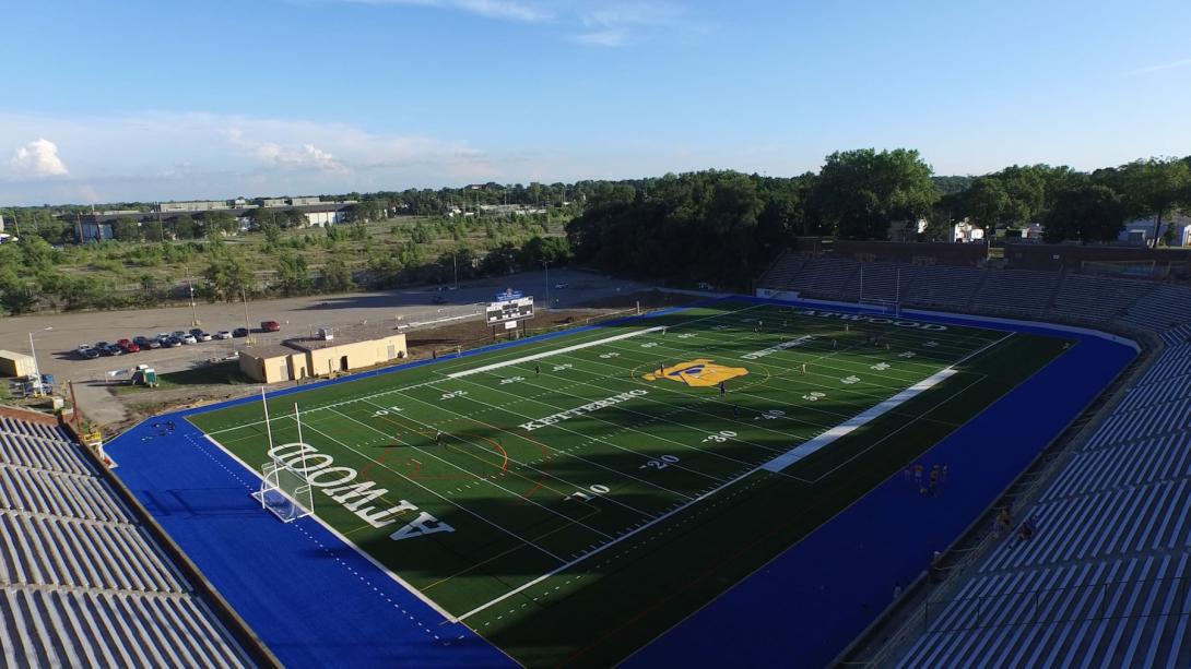 A aerial view of Atwood Stadium, owned by Kettering University. It has a green field with a blue border.