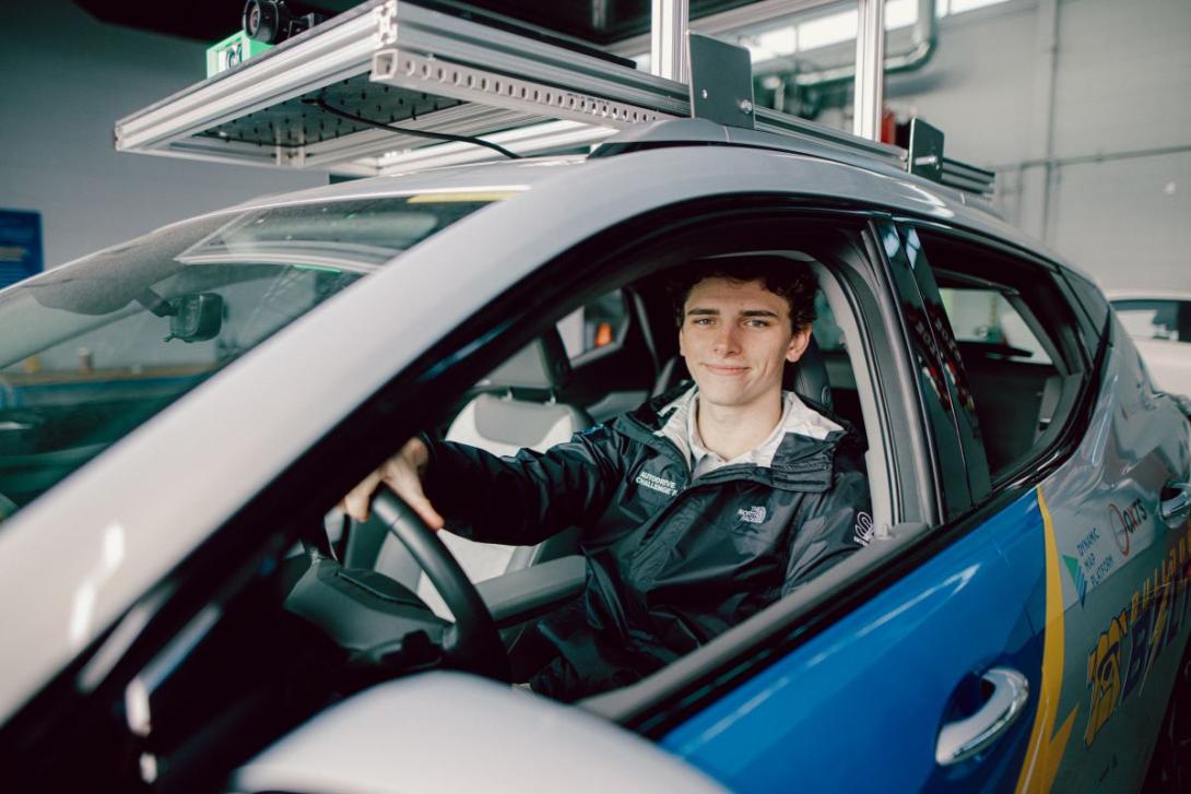 A Kettering student sits in a test vehicle outfitted with cameras and sensors