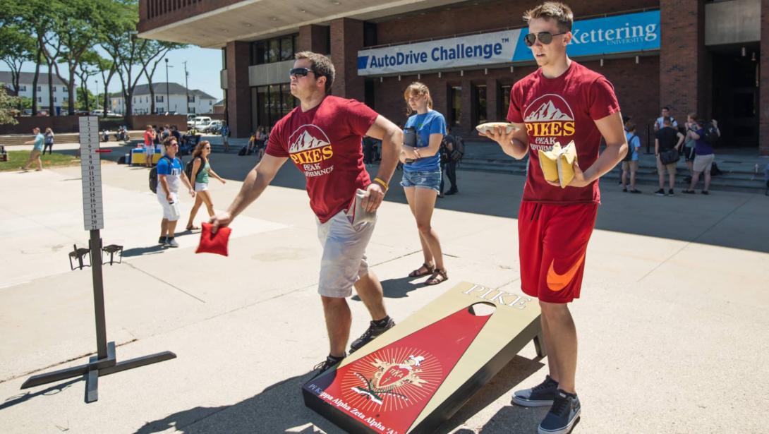 Pikes fraternity members play cornhole during Rush Week activities.