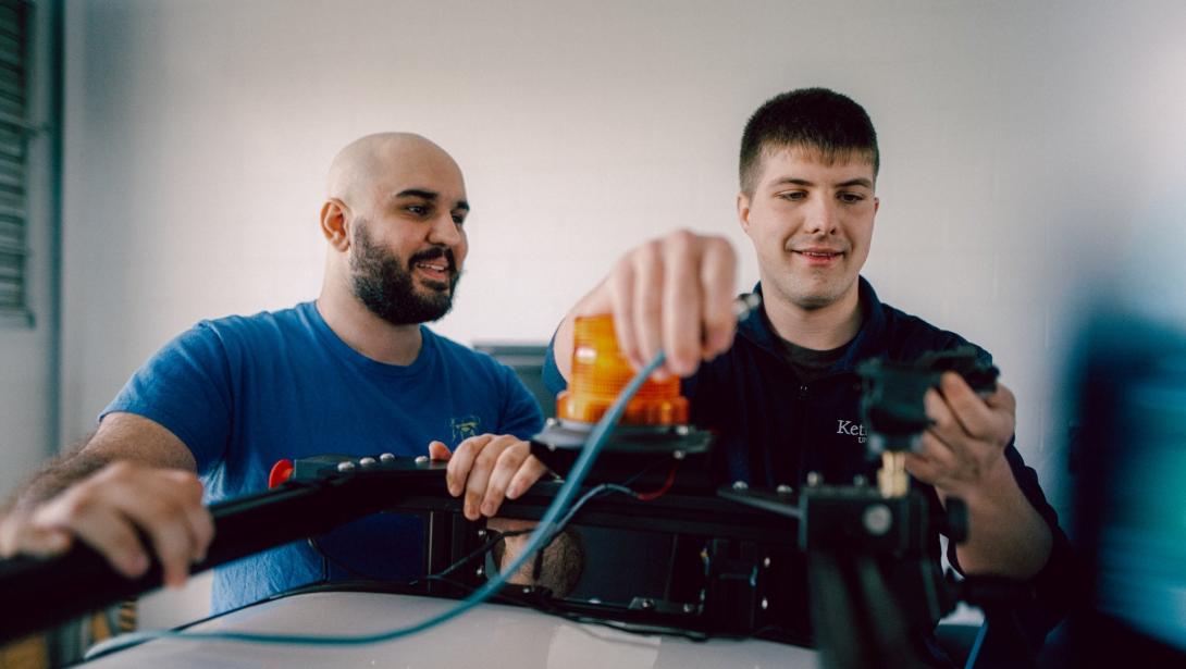 Computer Engineering students working with equipment