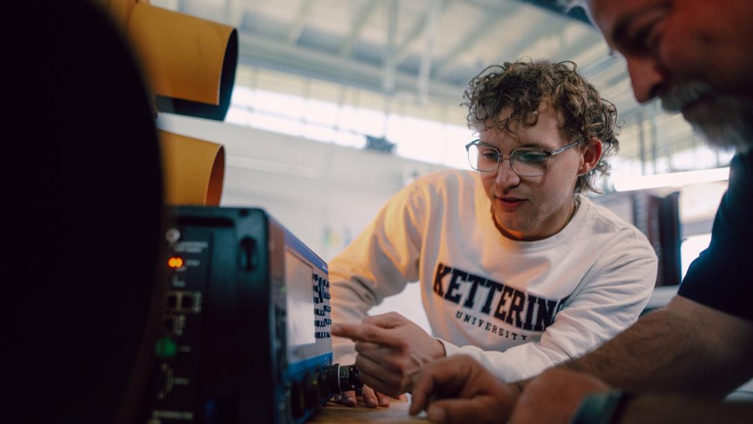 Computer Engineering students working with equipment