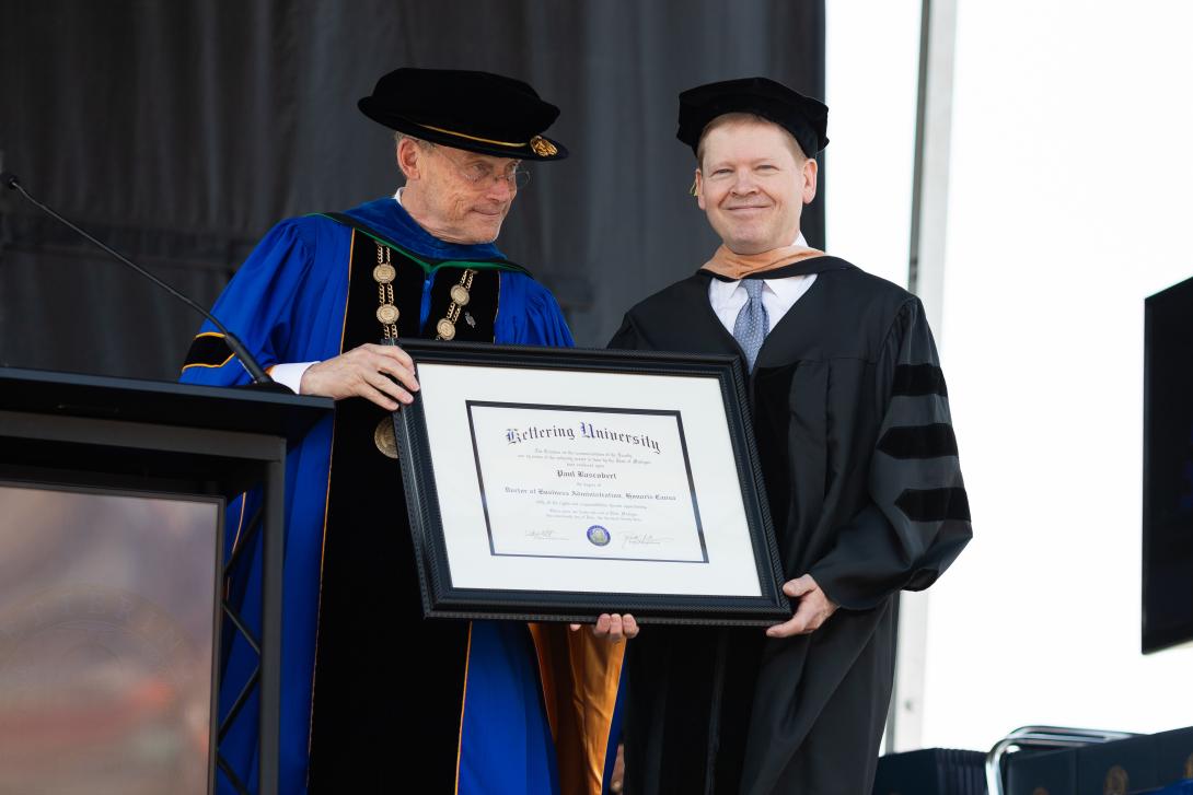 Paul Bascobert receiving honorary degree at commencement 