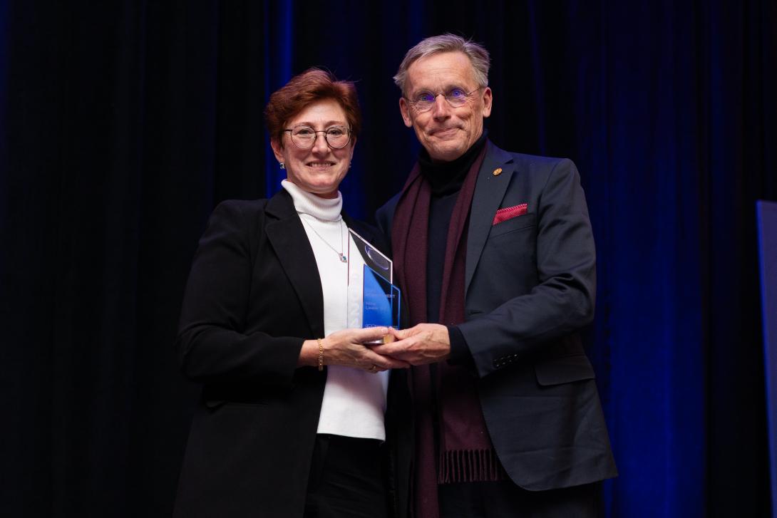 Nina (Dombrausky) Leask receiving an award from Dr. McMahan