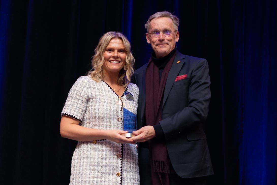 Amy MacDonald receiving award from Dr. McMahan