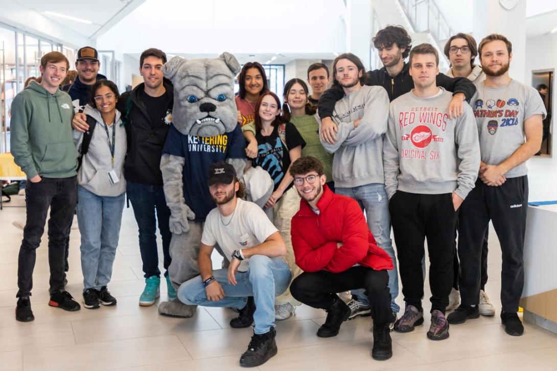 A group of Kettering students pose with the bulldog mascot in the Learning Commons