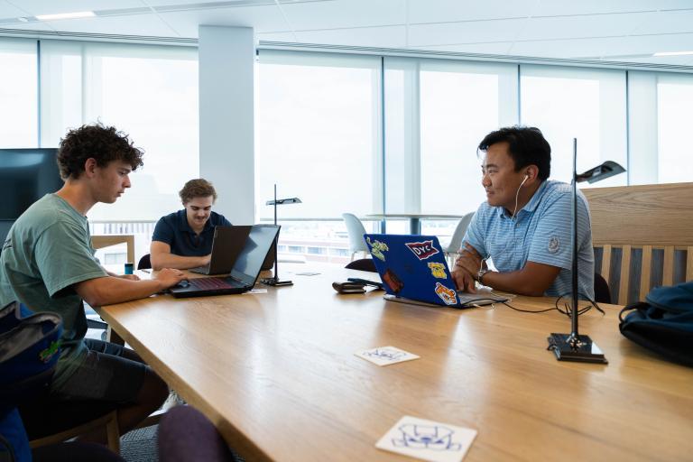 Students collaborate and focus on academic work in a bright, modern space at Kettering University's Learning Commons.