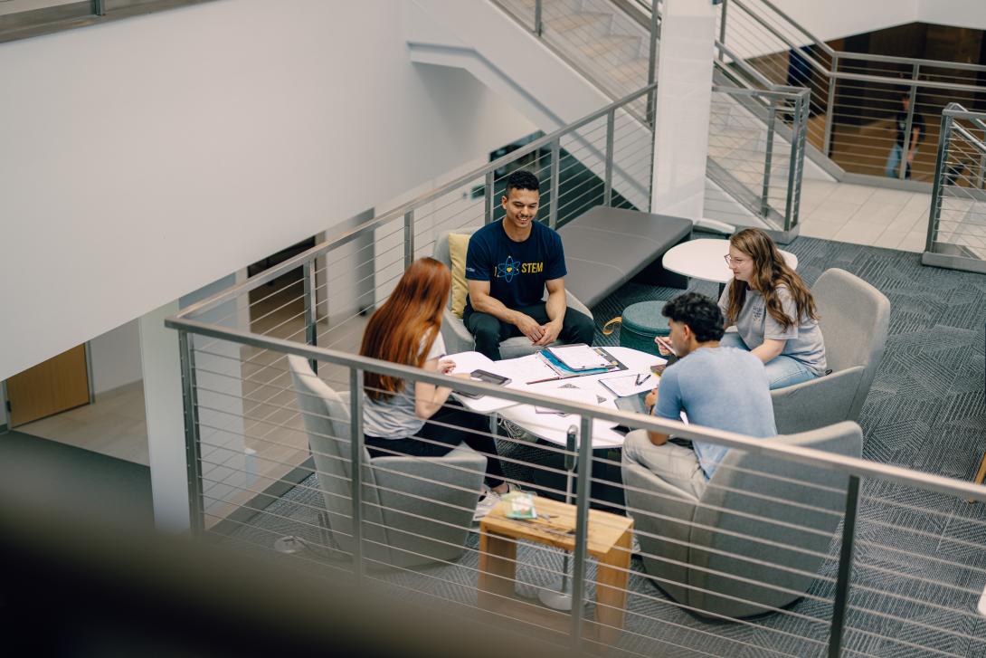 students studying above coffee shop in Learning Commons