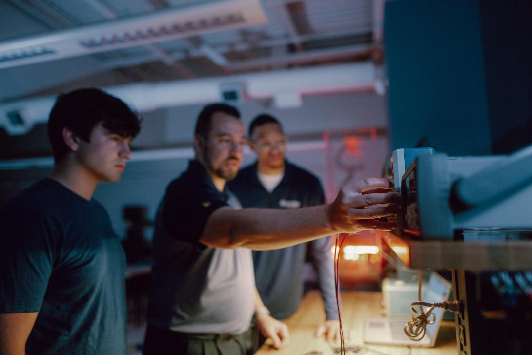 professor and students in design circut lab