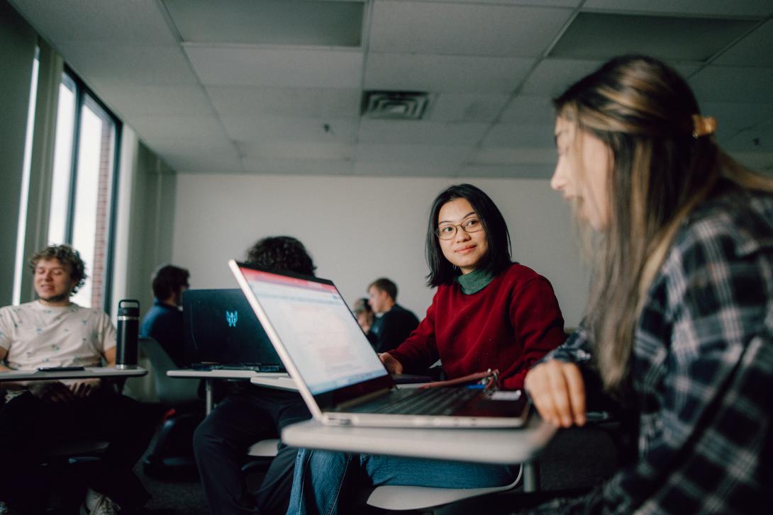 students engaging in conversation during class