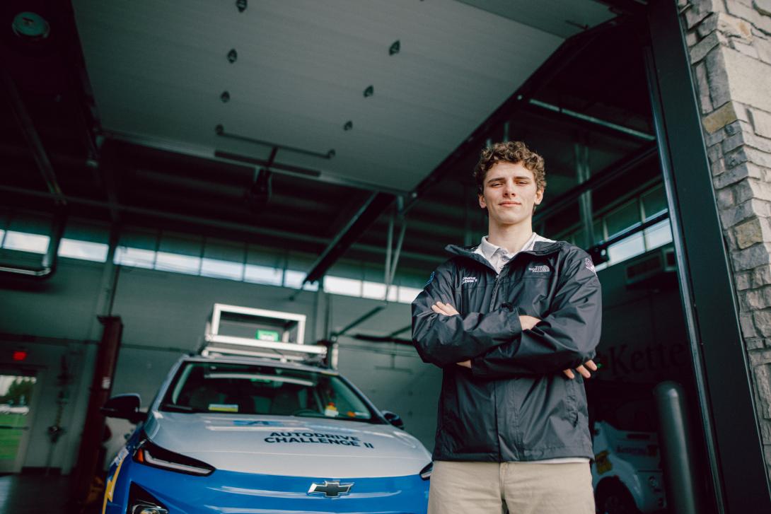 student standing in front of autodrive bolt