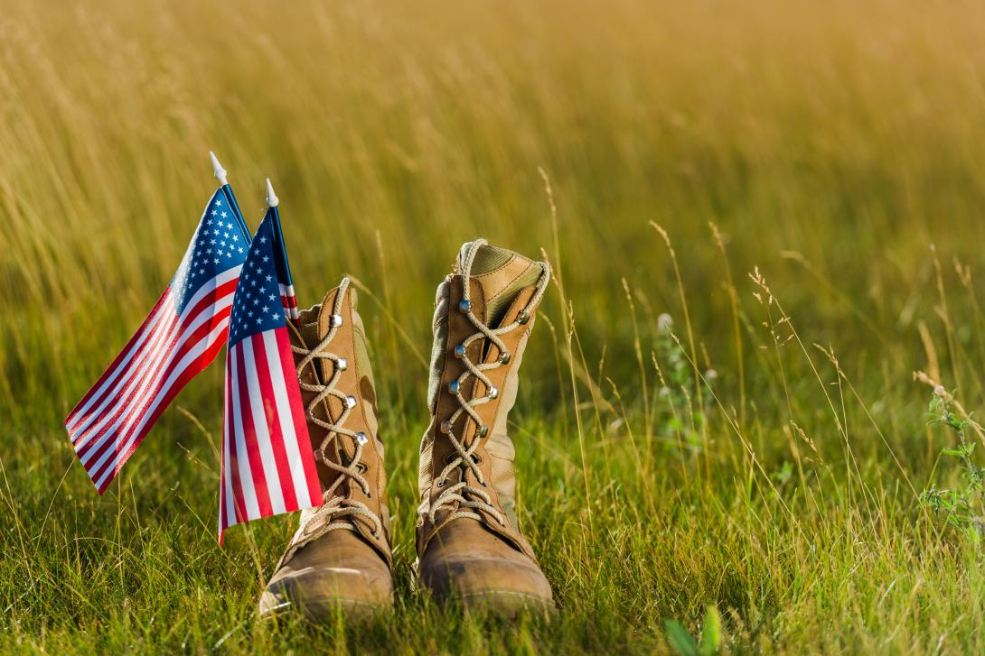 military boots near american flad