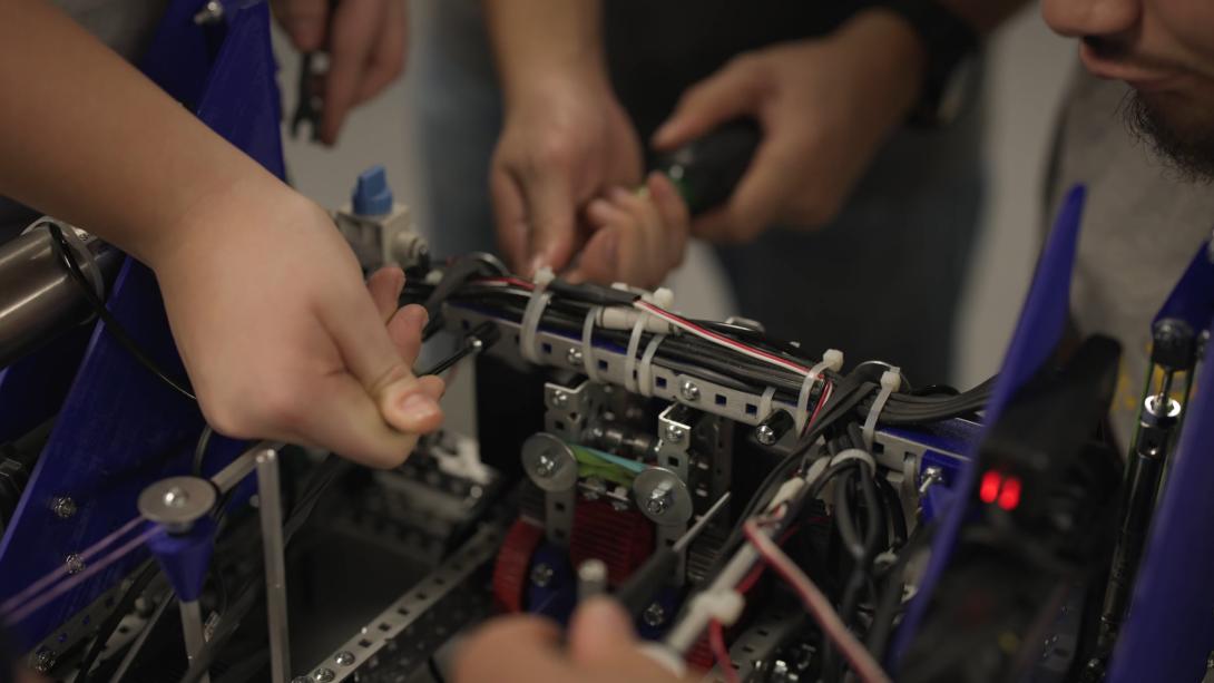 VEX U team working on robot