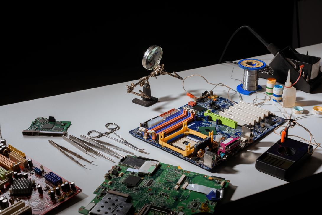 circuit-board-and-engineering-equipment-on-table